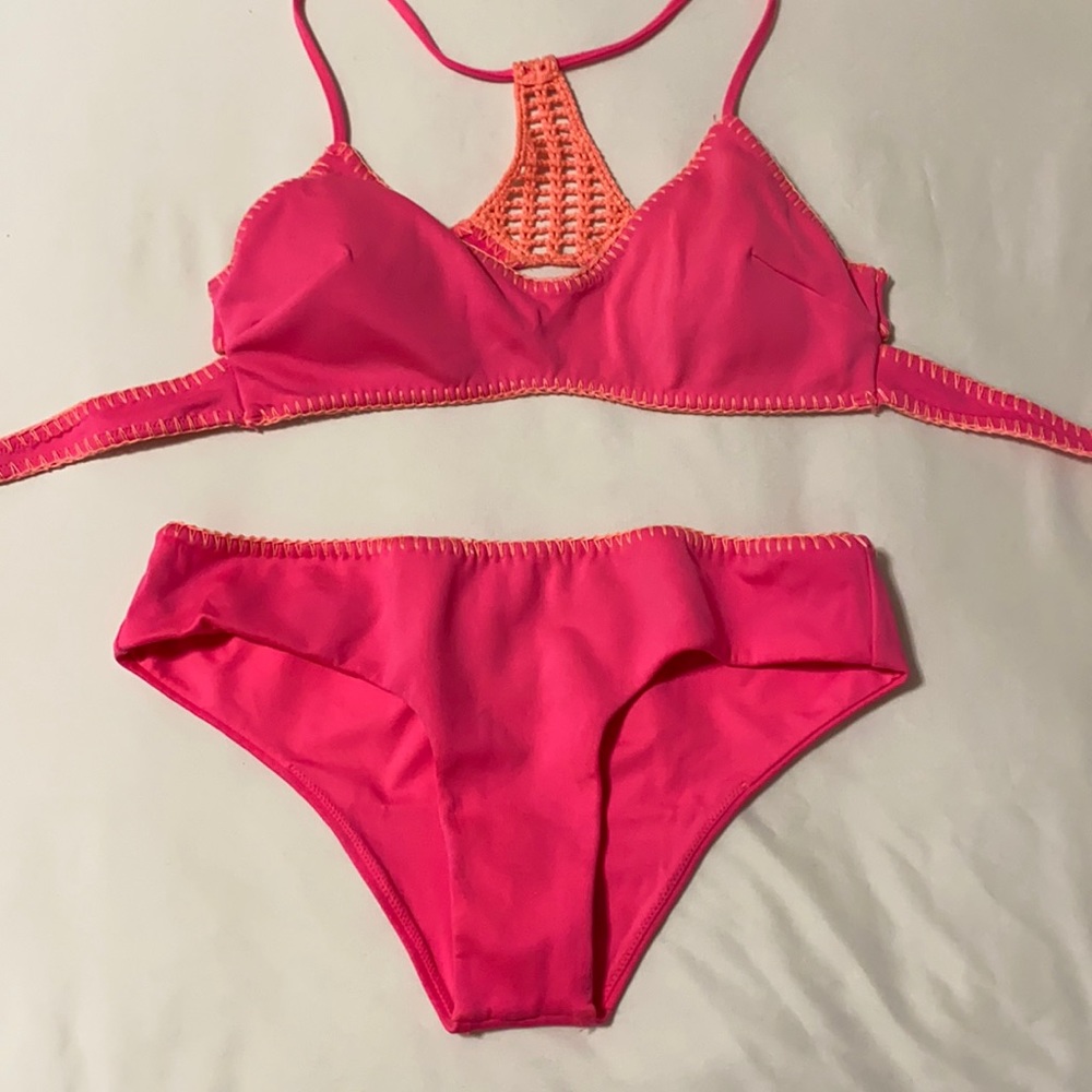 Fun hot pink swimsuit with a peach crochet back!
